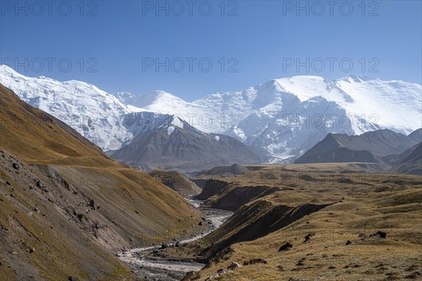 Valley with river Achik Tash between high mountains, mountain landscape with peak Pik Lenin, Osh