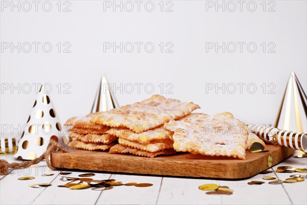 Fried Italian dessert snack for carnival season called 'Galani', ' Chiacchiere' or 'Crostoli'