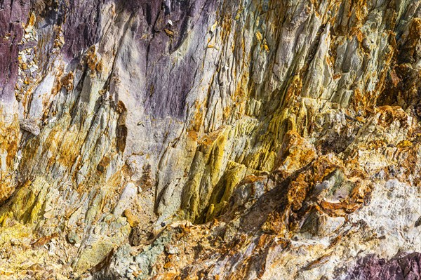 Coloured, ferrous mineral rocks on the beach of Topinetti, near Rio Marina, Elba, Tuscan