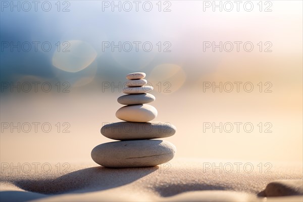 Zen stones stack on sand waves in a minimalist setting for balance and harmony. Balance, harmony,