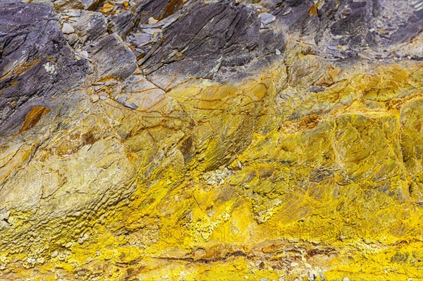 Coloured, ferrous mineral rocks on the beach of Topinetti, near Rio Marina, Elba, Tuscan