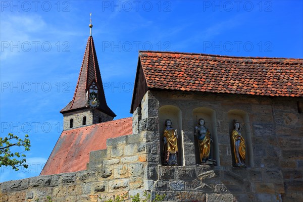 Entrance gate with Gothic wooden sculptures, St Sebastian, St George and St Laurentinus, fortified