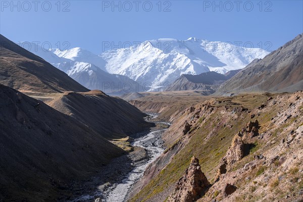 Valley with river Achik Tash between high mountains, mountain landscape with peak Pik Lenin, Osh