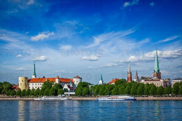 View of Riga over Daugava river: Riga Castle, St. James's Cathedral, St. Peter's Church. Riga,