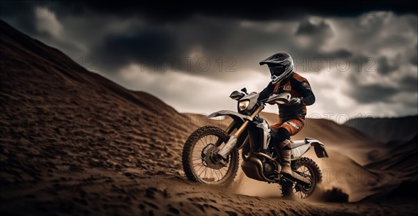 Motocross on an enduro motorcycle through mud and sand, a motorcyclist in gear and a helmet rides