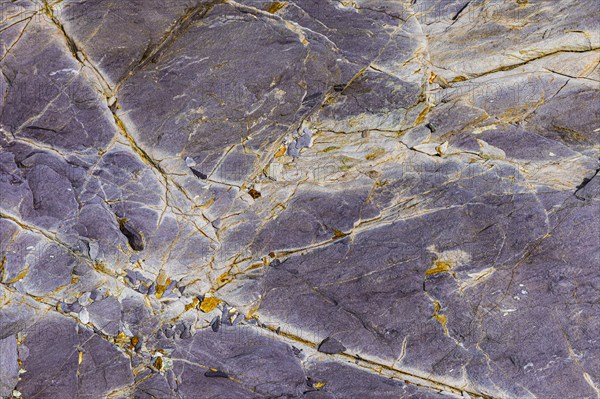 Coloured, ferrous mineral rocks on the beach of Topinetti, near Rio Marina, Elba, Tuscan