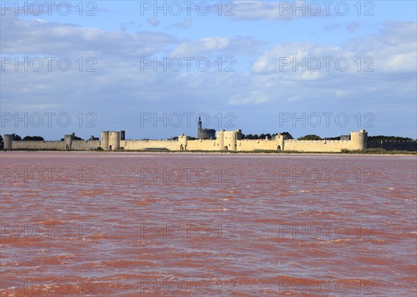 The medieval town of Aigues Mortes in the middle of the salt marshes, Gard, Petite Camargue,