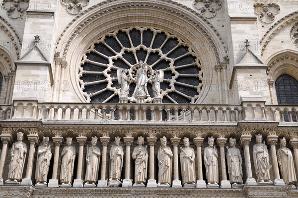 Figures of saints, detail on the Gothic entrance portal of Notre Dame de Paris Cathedral, Paris,