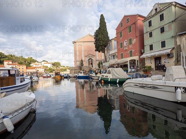 St. Anthony's Church in the morning light, boats in the harbour, Veli Losinj, Losinj Island,