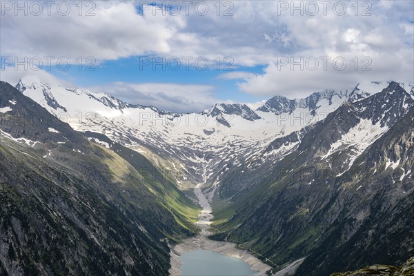 Mountain landscape, view of turquoise-blue lake Schlegeisspeicher, glaciated rocky mountain peaks