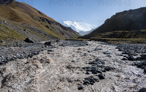 Valley with river Achik Tash between high mountains, mountain landscape with peak Pik Lenin, Osh
