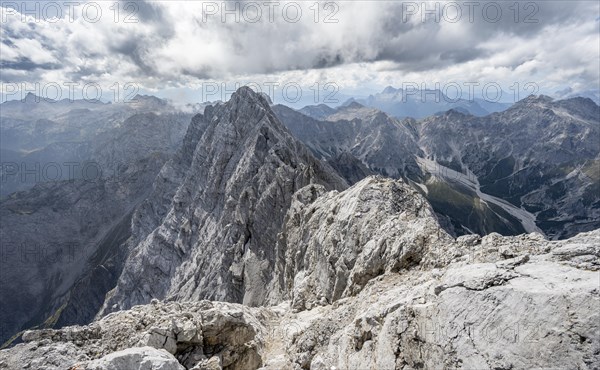 Rocky, narrow mountain ridge with Watzmann Suedspitze, view from Watzmann middle summit to mountain