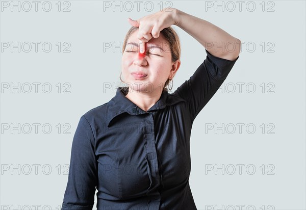 Young woman with pain touching nose. People with nasal bridge pain, Girl with nasal bridge headache