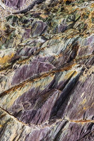 Coloured, ferrous mineral rocks on the beach of Topinetti, near Rio Marina, Elba, Tuscan