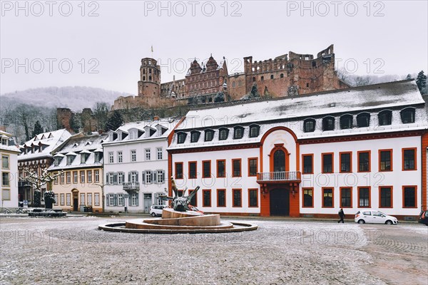 Heidelberg, Germany, February 2020: Town square called 'Karlsplatz' with snow in winter in historic