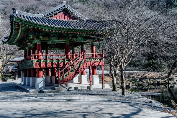 Oriental pavilion at Buddhist temple on late autumn morning