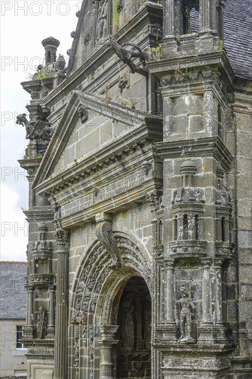Side portal of the church, Enclos Paroissial parish of Guimiliau, Finistere Penn ar Bed department,