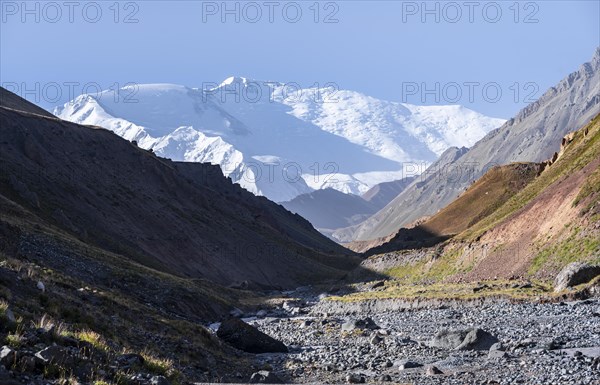 Valley with river Achik Tash between high mountains, mountain landscape with peak Pik Lenin, Osh