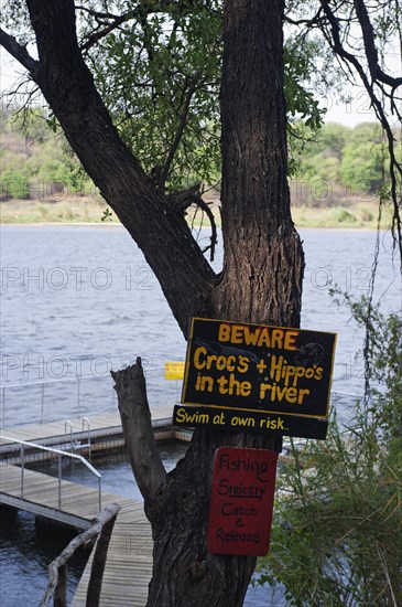 Warning of crocodiles and Hippopotamuses, swimming, bathing, danger, danger to life, pool, river in