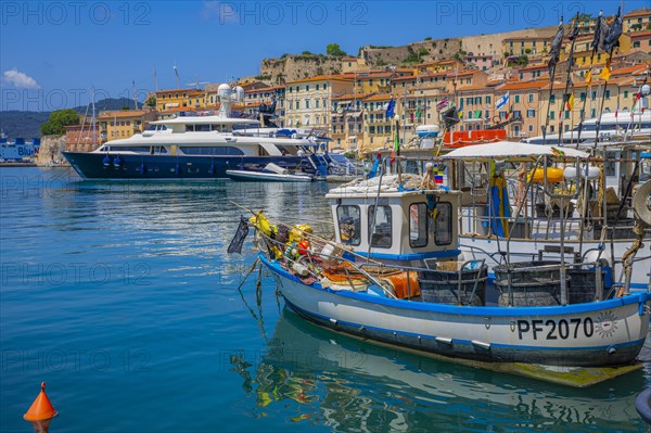 Fishing boats and luxury yachts in the harbour of Portoferraio, Elba, Tuscan Archipelago, Tuscany,