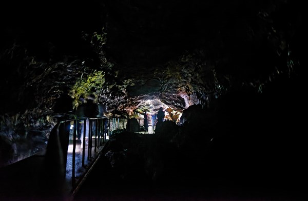 People walking to the cave exit in the lava tunnel Gruta das Torres, Gruta das Torres, Pico, Sao