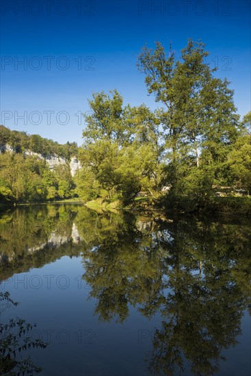River with gorge and autumnal coloured forest, valley of the Loue, Lizine, near Besancon,