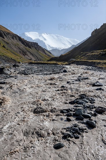 Valley with river Achik Tash between high mountains, mountain landscape with peak Pik Lenin, Osh