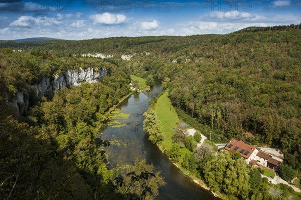 River with gorge and autumnal coloured forest, valley of the Loue, Lizine, near Besancon,