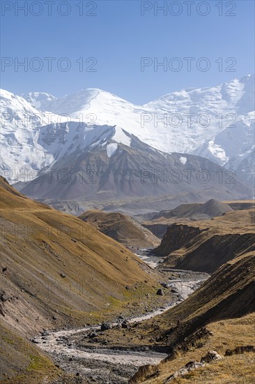 Valley with river Achik Tash between high mountains, mountain landscape with peak Pik Lenin, Osh