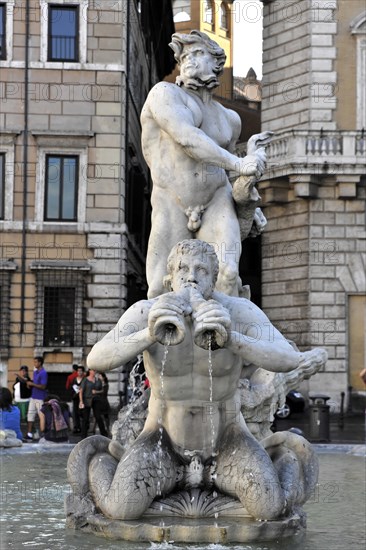 Fountain figure of a Triton, Moor Fountain or Fontana del Moro, Piazza Navona, Rome, Lazio, Italy,