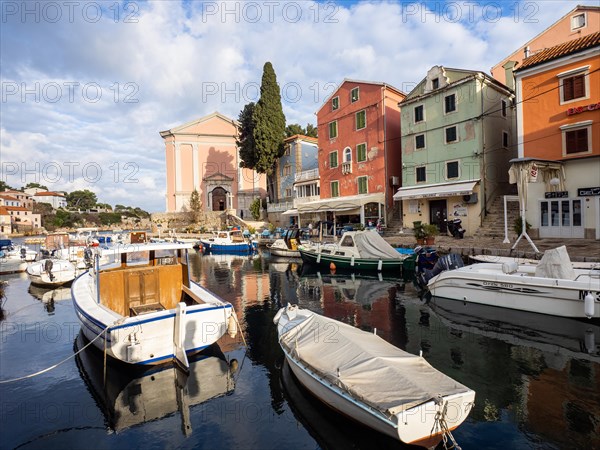 St. Anthony's Church in the morning light, boats in the harbour, Veli Losinj, Losinj Island,
