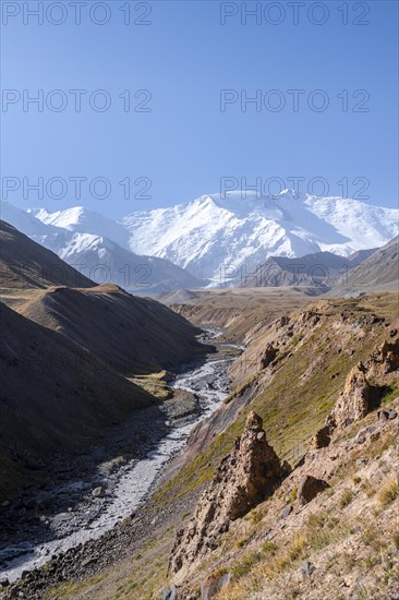 Valley with river Achik Tash between high mountains, mountain landscape with peak Pik Lenin, Osh