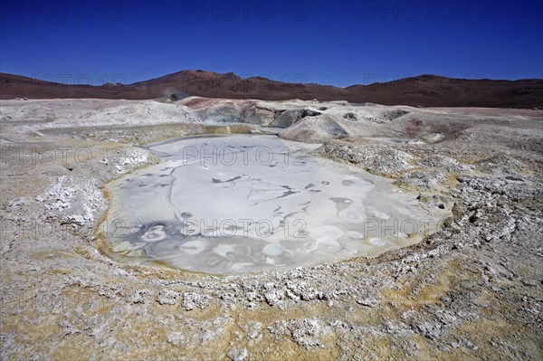 Mud lakes and steam pools with boiling mud in geothermal field Sol de Manana, Altiplano, Bolivia,