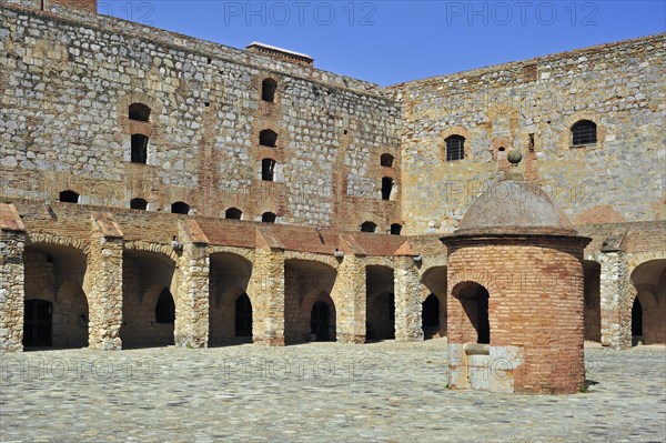 Inner court and well of the Catalan fortress Fort de Salses at Salses-le-Chateau, Pyrenees, France,