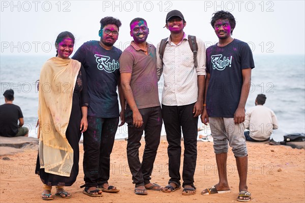 Group of young people with colour on their faces, Holi Festival, Indian spring festival,