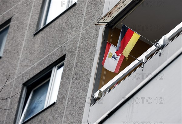 A tenant in the Gropiushaus has decorated his balcony with a German flag and the flag of Berlin.
