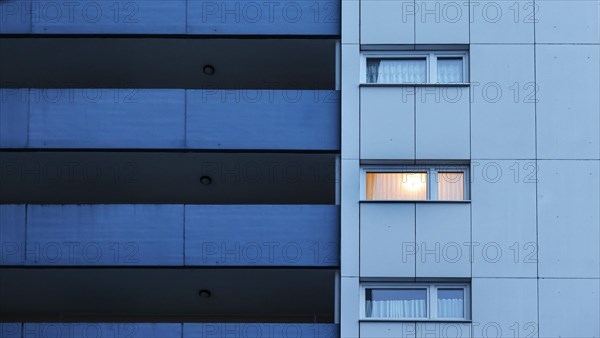 Illuminated room in a tower block in Gropiusstadt. The rise in rents in German cities has increased