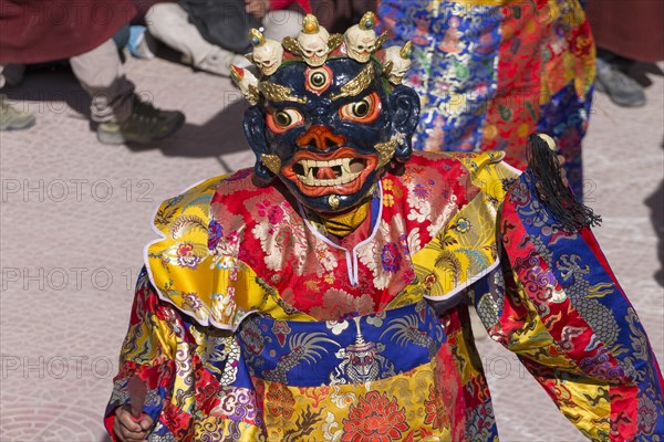 A monk performing cham, the sacred religious masked dance, during the Spituk Gustor winter festival