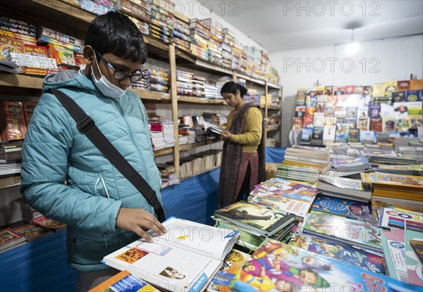 Book readers browsing books at a stall during Assam Book Fair, in Guwahati, Assam, India on 29