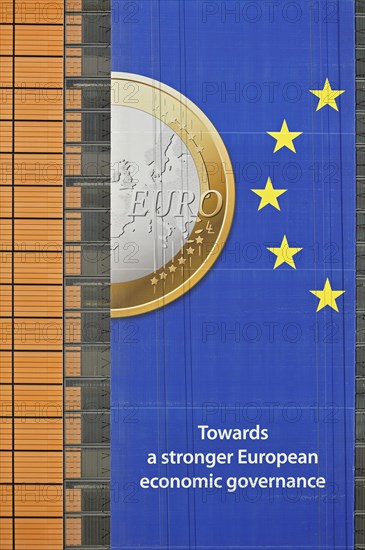Banner about the euro hanging from the Berlaymont building of the European Commission, executive