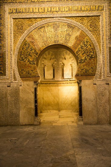 Richly inscribed stonework of keyhole shaped Mihrab, the centrepiece of the Great Mosque, Cordoba,