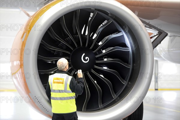 Olaf Gross, Licence Engineer at easyJet, checks the engine of an Airbus A320 Neo in front of the