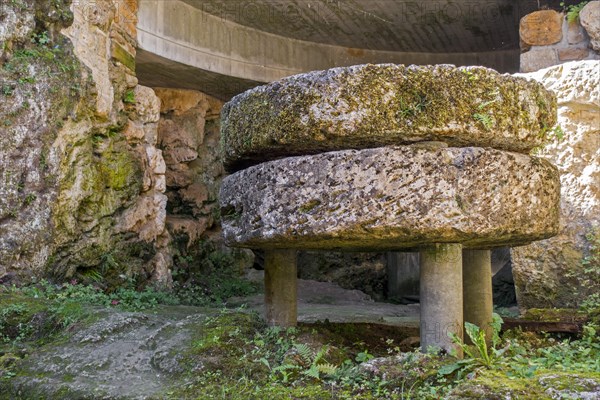 Old millstones in the Trou des Fees at the village Chassepierre near Florenville in the province of