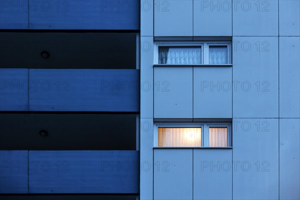Illuminated room in a tower block in Gropiusstadt. The rise in rents in German cities has increased