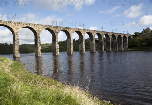 Stone arches of railway viaduct crossing River Tweed, Berwick-upon-Tweed, Northumberland, England,