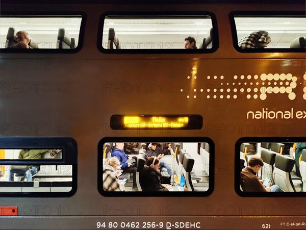 National Express RE6 double-decker commuter train in the evening, Duesseldorf Central Station,