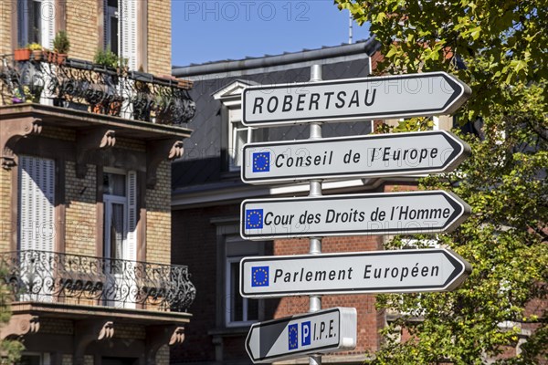 Signpost with directions to the several European Union office buildings in the European quarter at