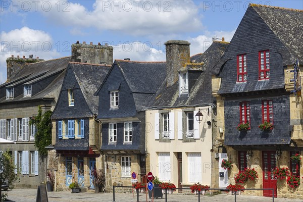 Rue du General de Gaulle in the old town centre of Le Faou with slate-roofed granite houses from