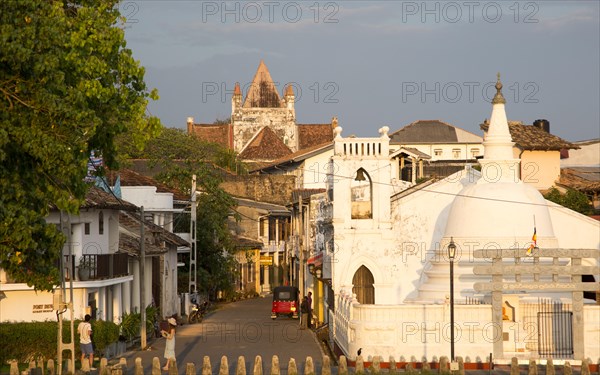 Street and house in historic town of Galle, Sri Lanka, Asia with Christian church and Buddhist