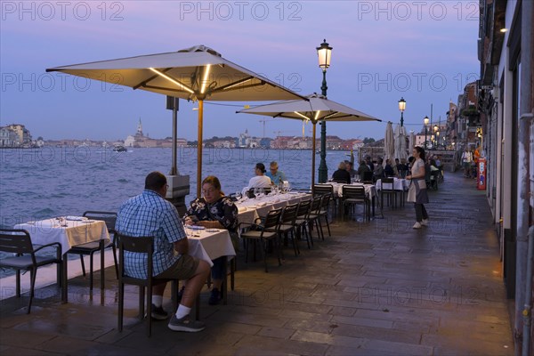 Restaurant on the waterfront of the Guidecca Canal, Dorsoduro district, Venice, Veneto, Italy,